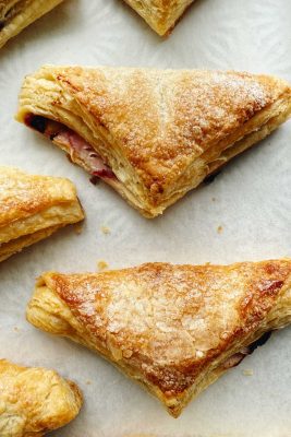 sour cherry turnovers on parchment paper