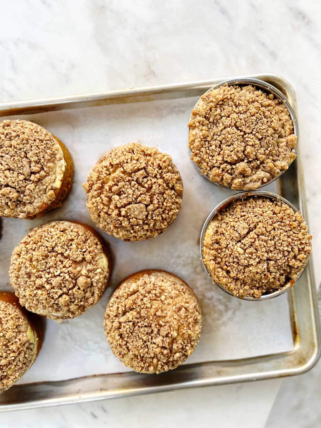 pumpkin cakes on a sheet pan.