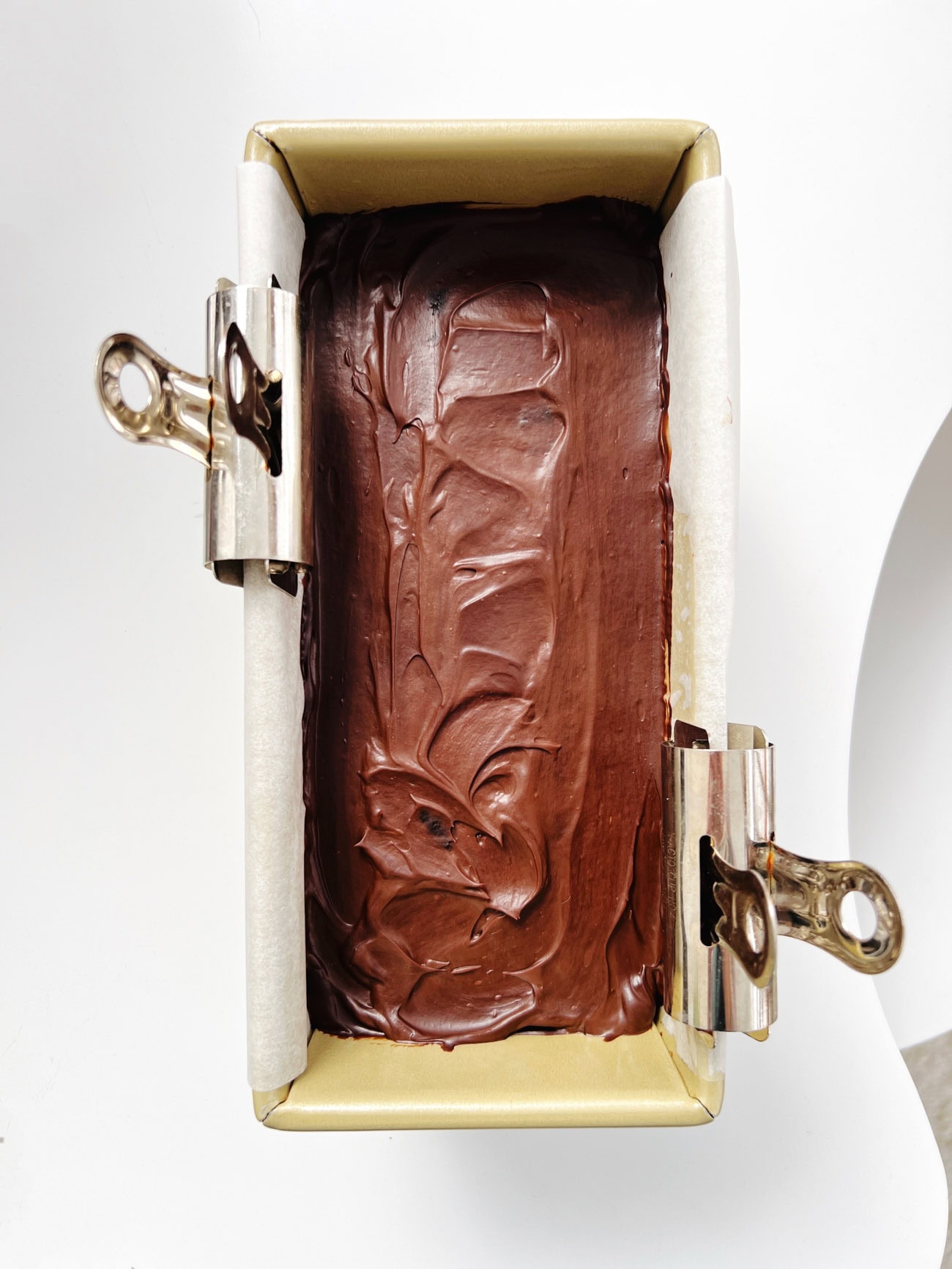 chocolate batter in a loaf pan