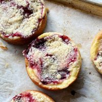 cherry streusel cakes on a baking sheet