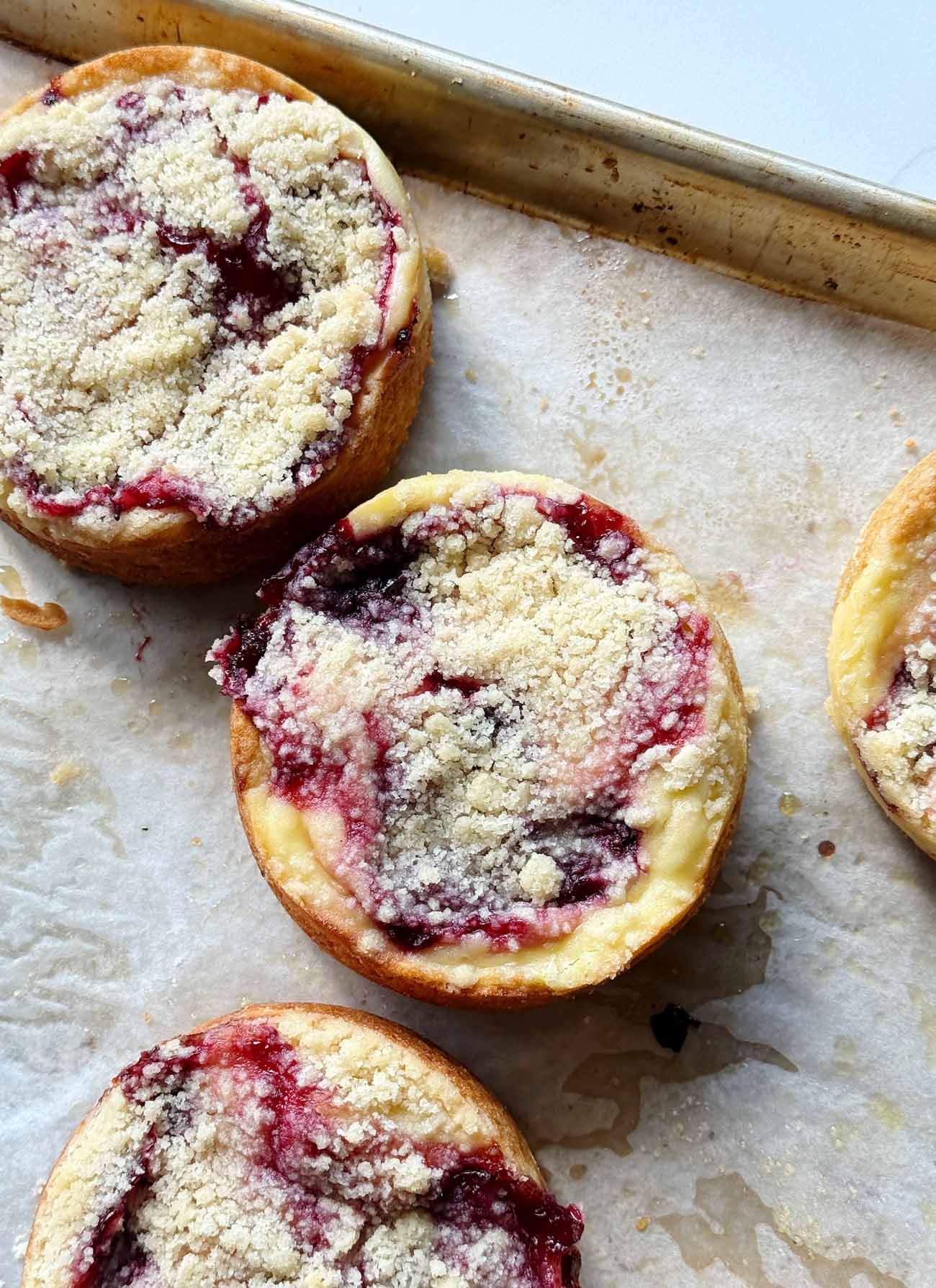 cherry streusel cakes on a baking sheet