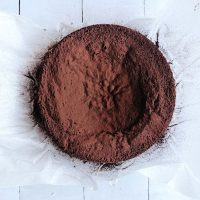 sunken chocolate cake on parchment paper