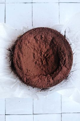 sunken chocolate cake on parchment paper